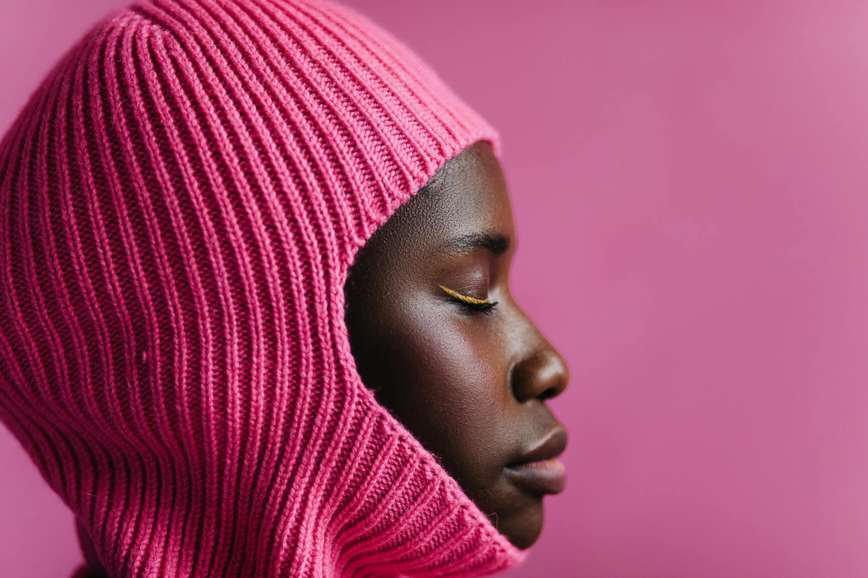 woman-eyes-closed-pink-background-braver-vs-courage