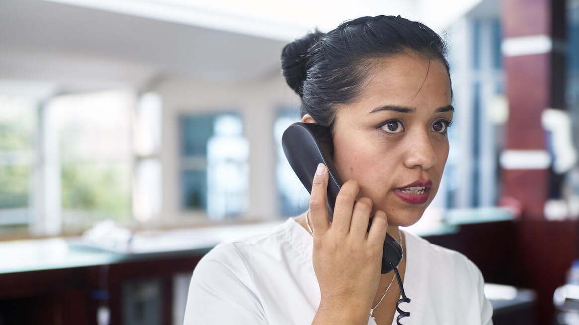 work-anxiety-a-person-takes-a-phone-call-stressed